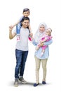 Cute children and parents standing in studio