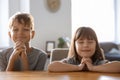 Cute children praying at home Royalty Free Stock Photo