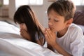 Cute children praying near bed at home Royalty Free Stock Photo