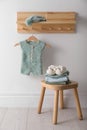 Cute children`s clothes and shoes in room Royalty Free Stock Photo