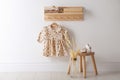 Cute children`s clothes and shoes in room Royalty Free Stock Photo