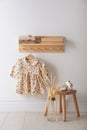 Cute children`s clothes and shoes in room Royalty Free Stock Photo