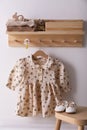 Cute children`s clothes and shoes in room Royalty Free Stock Photo