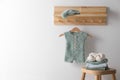 Cute children`s clothes and shoes in room. Space for text Royalty Free Stock Photo