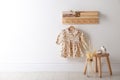 Cute children`s clothes and shoes in room. Space for text Royalty Free Stock Photo