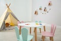 Children`s room interior with teepee tent and little table