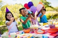 Cute children smiling and having fun during a birthday party Royalty Free Stock Photo