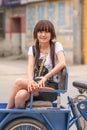 Cute Chinese girl sit on het trike, Zhuozhou, Hebei Province, China