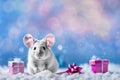 Cute christmas mouse with gifts on snow