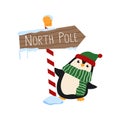 Cute Christmas penguin holding North Pole sign. Cartoon animal wearing a winter hat and a striped scarf. Royalty Free Stock Photo