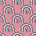 Cute christmas rainbows seamless pattern with colorful decorative rainbows and xmas lights on pink