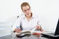 Cute chubby girl studying for exams Royalty Free Stock Photo