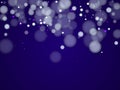White abstract snowflakes over dark blue background. Royalty Free Stock Photo
