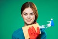 cute cleaning lady rubber gloves detergents green background