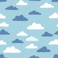 Cute cloud pattern featuring white and navy blue clouds on a light blue background. Royalty Free Stock Photo