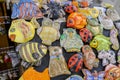 Cute colorful ceramic owls, fishes, bugs toys of different sizes close-up. souvenir shop in the market Royalty Free Stock Photo