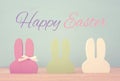 Cute colorful wooden bunny ears over background.