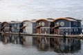 Cute, colourful floating houseboats line the docks in Mosquito Creek Marina, North Vancouver,
