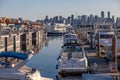 Cute, colourful floating houseboats line the docks in Mosquito Creek Marina, North Vancouver,