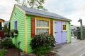 Cute colourful small wooden cabin on seaside wharf