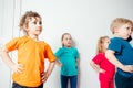 Kids doing stretching exercises before gymnastic training Royalty Free Stock Photo