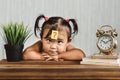 Cute and confused lookian asian toddler with question mark on her forehead Royalty Free Stock Photo