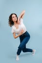 Cute contemporary dancer crossing her legs in a lunge forward Royalty Free Stock Photo