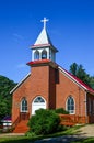 Country Brick Church with White Cross Steeple Royalty Free Stock Photo
