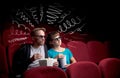 Cute couple in cinema watching movie Royalty Free Stock Photo