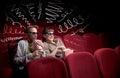 Cute couple in cinema watching movie Royalty Free Stock Photo