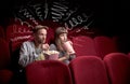 Cute couple in cinema watching movie Royalty Free Stock Photo