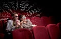 Cute couple in cinema watching movie Royalty Free Stock Photo