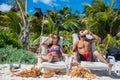 Cute Couple drinking Coconut at Tulum caribbean beach. Riviera M Royalty Free Stock Photo