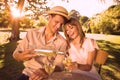 Cute couple drinking white wine together outside