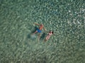 Cute couple floating in the sea