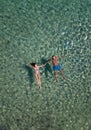 Cute couple floating in the sea