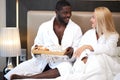 Cute couple have breakfast on bed Royalty Free Stock Photo