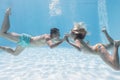 Cute couple kissing underwater in the swimming pool Royalty Free Stock Photo