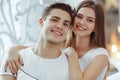 Cute couple in love spending time together.Woman embracing her partner in bed. Celebrating Saint Valentine`s day Royalty Free Stock Photo