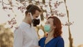 Cute couple makes funny moments in face masks