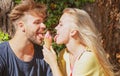 Cute couple romantic dating and eating ice cream. Young pair sharing icecream. True love. Man with woman in relations. Royalty Free Stock Photo