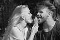 Cute couple romantic dating and eating ice cream. Young pair sharing icecream. True love. Man with woman in relations. Royalty Free Stock Photo