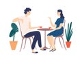 Cute couple sitting at table, drinking tea or coffee and talking. Young funny man and woman at cafe on date. Dialog or Royalty Free Stock Photo