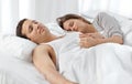 Cute couple sleeping together on their bed Royalty Free Stock Photo