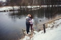 Cute couple standing in a winter park Royalty Free Stock Photo