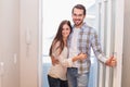 Cute couple walking through the door Royalty Free Stock Photo