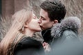 A cute couple of young people in love kissing hugging each other and experiencing tender feelings, Valentine`s Day Royalty Free Stock Photo