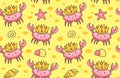 Cute crabs in the golden crowns on a sand background.