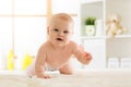 Cute crawling baby girl at home