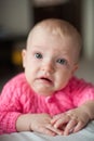 Cute crying baby, upset teething girl. Sad child look at the camera Royalty Free Stock Photo